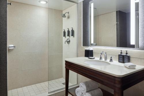 a bathroom with a sink and a shower at Sheraton Valley Forge King of Prussia in King of Prussia