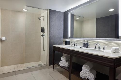 a bathroom with a sink and a shower at Sheraton Valley Forge King of Prussia in King of Prussia
