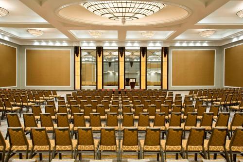 an empty lecture hall with rows of chairs at Sheraton Valley Forge King of Prussia in King of Prussia