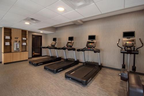 a row of treadmills in a fitness room at Courtyard by Marriott Cincinnati Airport in Erlanger