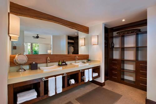 a bathroom with two sinks and a large mirror at El Mangroove Papagayo, Autograph Collection in Papagayo, Guanacaste