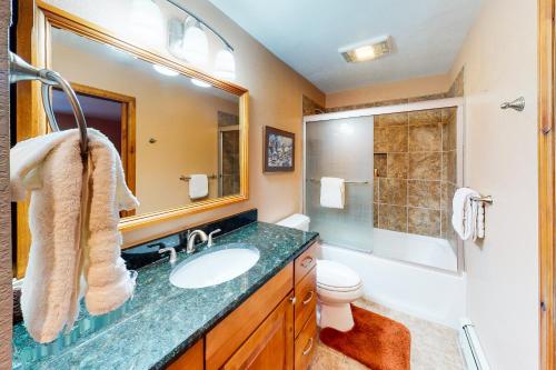 a bathroom with a sink and a shower and a toilet at Snowmas Village 20C in Snowmass Village