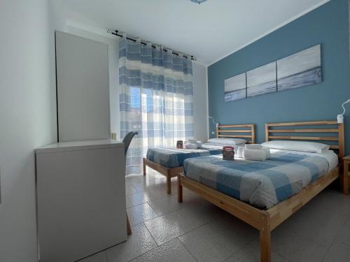 מיטה או מיטות בחדר ב-La StorHouse nuovo Appartamento sul corso principale appena ristrutturato