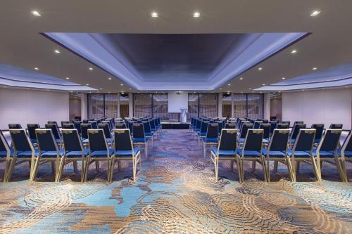a conference room with chairs and a stage in the middle at Four Points by Sheraton Singapore, Riverview in Singapore