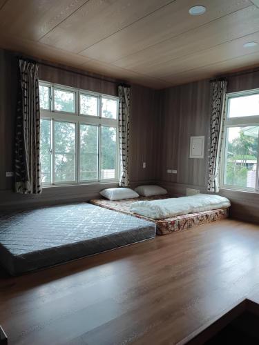 Postel nebo postele na pokoji v ubytování Ming Camphor Homestay