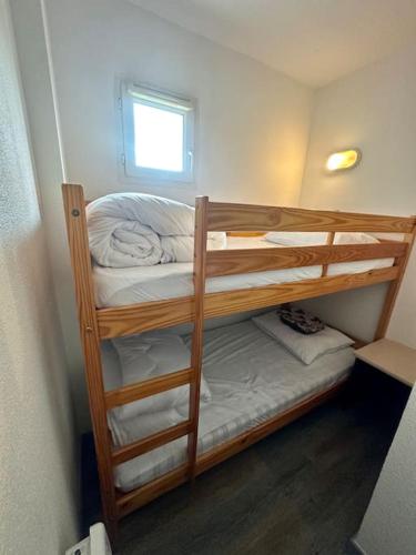 a couple of bunk beds in a room at Lourdes Home in Lourdes