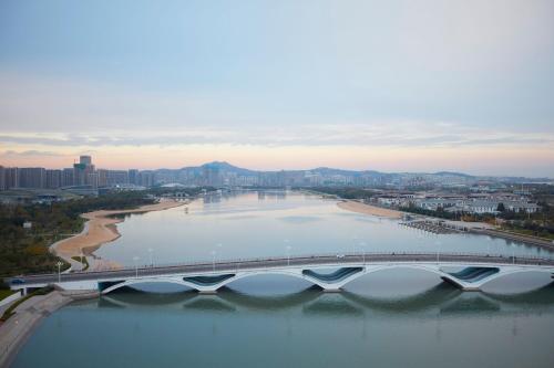 an aerial view of a bridge over a body of water at Sheraton Rizhao Hotel in Rizhao
