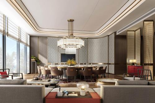 a rendering of a dining room with a table and chairs at Sheraton Rizhao Hotel in Rizhao