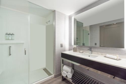 a bathroom with a sink and a mirror at Residence Inn by Marriott Boston Waltham in Waltham