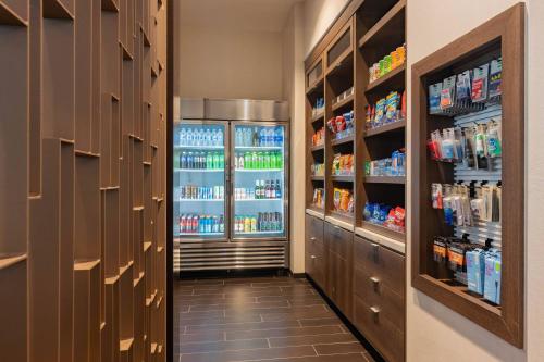 a hallway with a refrigerator filled with drinks at TownePlace Suites by Marriott Thousand Oaks Agoura Hills in Agoura Hills