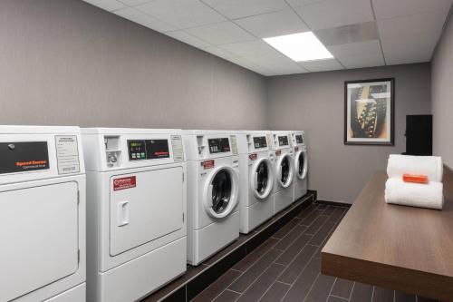 a laundry room with a row of washing machines at TownePlace Suites by Marriott Thousand Oaks Agoura Hills in Agoura Hills