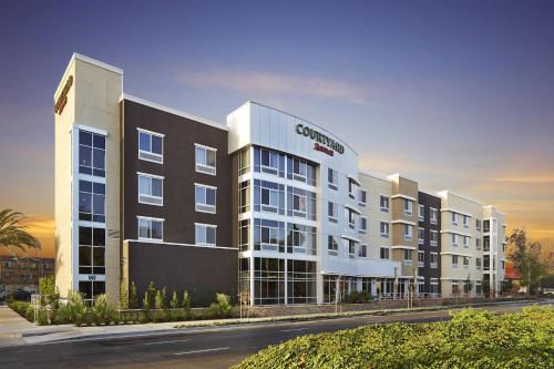 a rendering of a condo building in a city at Courtyard by Marriott Sunnyvale Mountain View in Sunnyvale