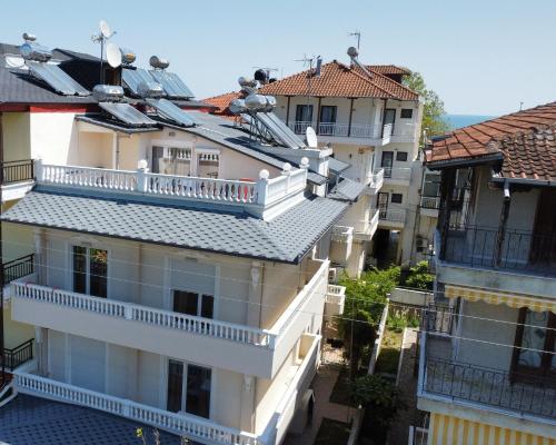 an aerial view of buildings with roofs at Indigo luxury apartments in Olympiaki Akti