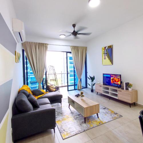 a living room with a couch and a tv at Atlantis residence #2Bedroom #2-8Pax in Melaka