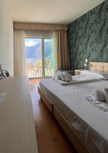 Postel nebo postele na pokoji v ubytování Albergo San Remo