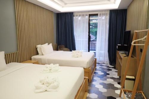 Un ou plusieurs lits dans un hébergement de l'établissement Only Seed Resort 欧芮希度假酒店