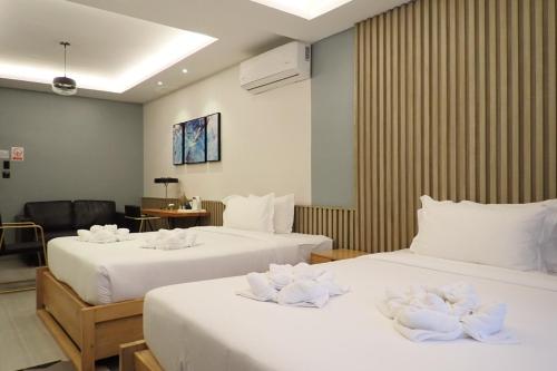 Un ou plusieurs lits dans un hébergement de l'établissement Only Seed Resort 欧芮希度假酒店
