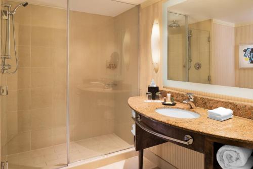 a bathroom with a sink and a shower at Sheraton Bloomington in Bloomington