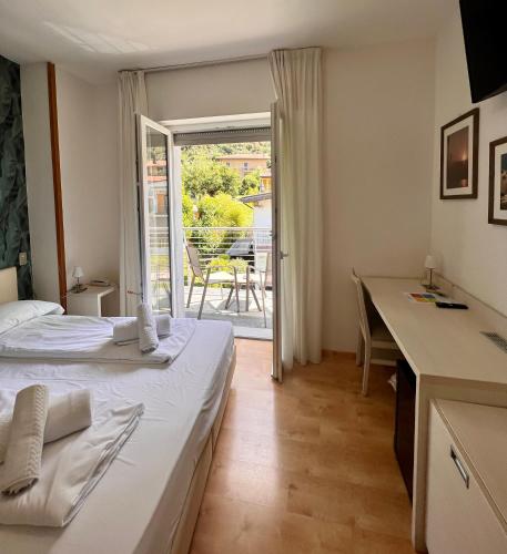 Postel nebo postele na pokoji v ubytování Albergo San Remo
