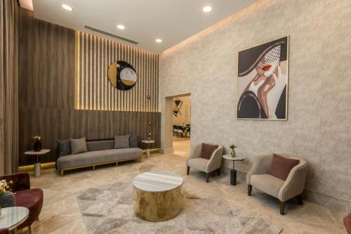a lobby with a waiting room with a table and chairs at Gewan Resort New Alamein in El Alamein