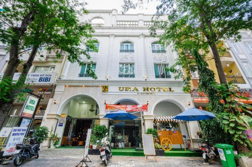 a white building with a store in front of it at La Serena Hotel & Apartment in Ho Chi Minh City