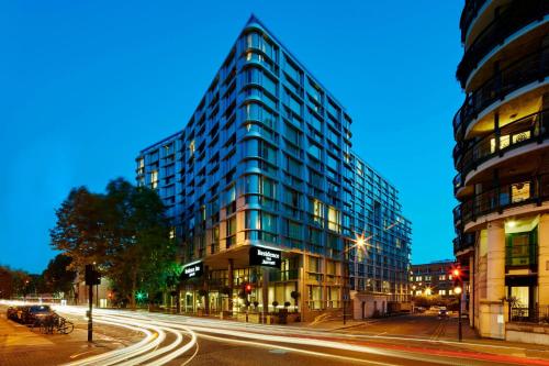 a tall building on a city street at night at Residence Inn by Marriott London Kensington in London