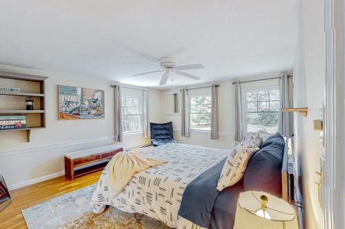 a bedroom with a bed and a ceiling fan at Hazel Retreat in Barnstable