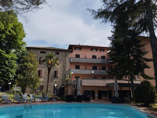 a large swimming pool in front of a building at Hotel Park Ge.Al. in Città di Castello