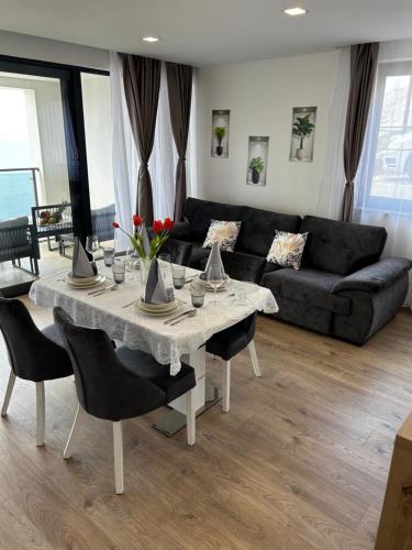 a living room with a table and a couch at Ivana&Luka-Put luke 1, Brela in Brela