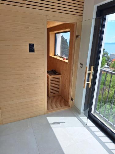 an empty room with a window and a door at Ivana&Luka-Put luke 1, Brela in Brela