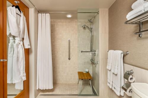 a bathroom with a shower with a glass door at The Westin Resort & Spa, Whistler in Whistler