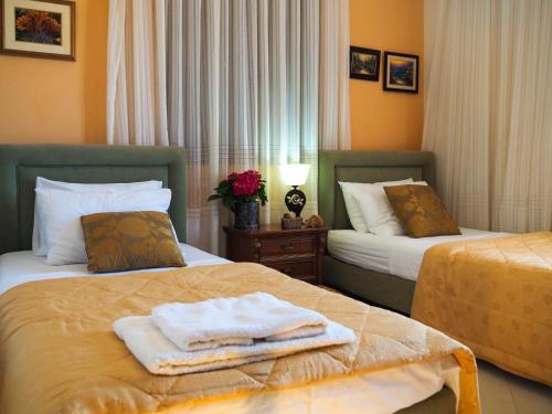 A bed or beds in a room at Villa Antikleia