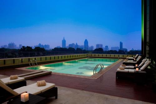 a swimming pool on the roof of a building at JW Marriott Hotel Shenzhen in Shenzhen