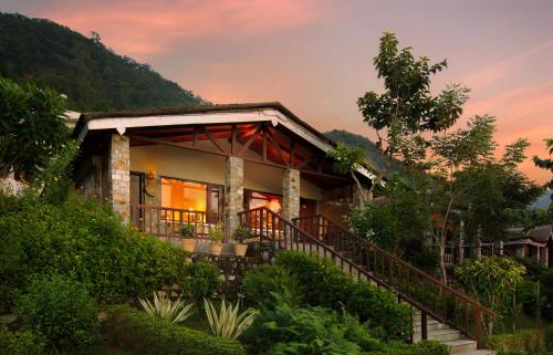 a house with a staircase leading up to it at Sterling Corbett in Marchula