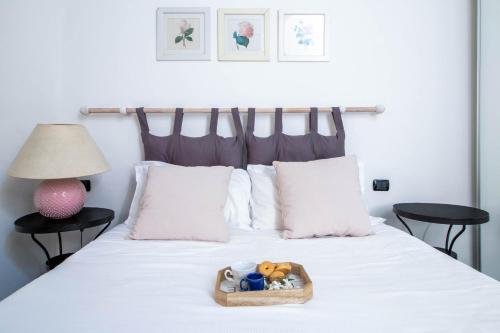 a tray of toys sitting on a bed at Levante by PortofinoHomes in Portofino