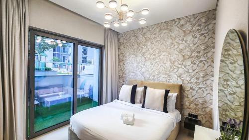 Postel nebo postele na pokoji v ubytování STAY BY LATINEM Luxury 1BR Holiday Home CV A103 near Burj Khalifa