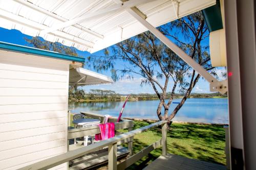 a view of the water from the porch of a house at Ingenia Holidays Nambucca Heads in Nambucca Heads
