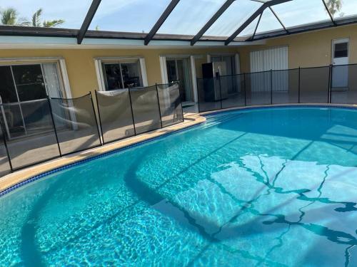 a swimming pool with blue water in a house at Airbnb rental in Miami