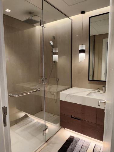 a bathroom with a shower and a sink at Three Bedrooms Apartment at Address Residence Fujairah - AFR3203 in Fujairah