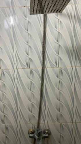 a bathroom with a shower with a glass wall at RUMAH 25 SYARIAH in Bukittinggi