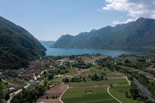 an aerial view of a town next to a lake at Nonna Elvira Holiday House in Bondone