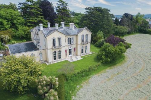 an aerial view of a large house on a field at Rumwell Park - 8 Bedroom Manor House- Taunton in Taunton
