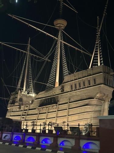 a large cruise ship is lit up at night at The Ambiance, Melaka in Melaka