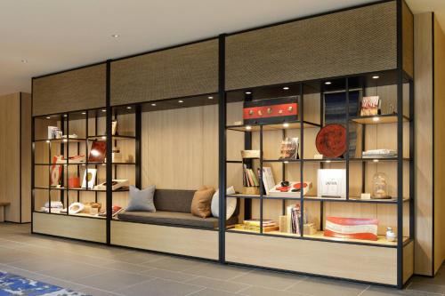 a display case with a couch in a room at Fairfield by Marriott Tochigi Motegi in Motegi