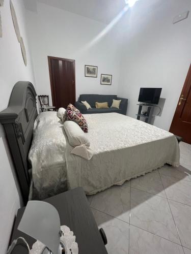מיטה או מיטות בחדר ב-Casa Centamore