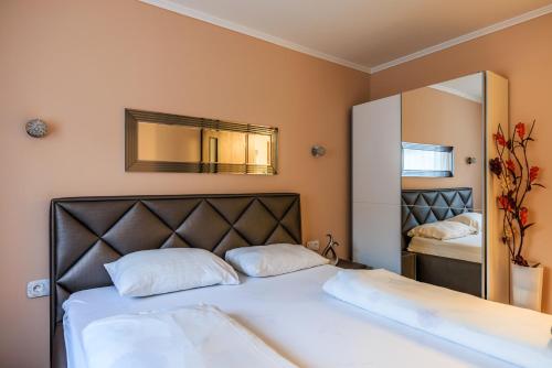 Katil atau katil-katil dalam bilik di Orchidea Apartman