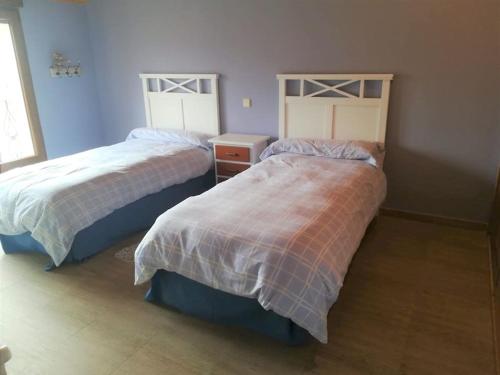 Katil atau katil-katil dalam bilik di Casa con jardín en Rascafría