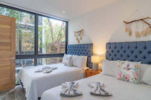 Voodi või voodid majutusasutuse Exclusive Villa "Town House" Luxury Amenities in Tulum toas