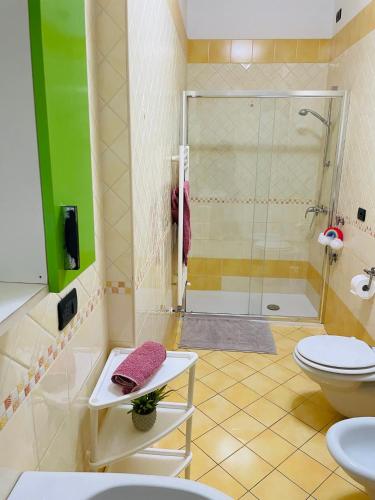 a bathroom with a shower and a toilet and a sink at Rosa Virginia Apartment in Gallipoli