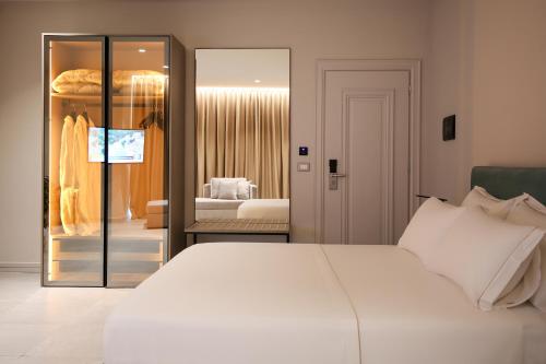 Ένα ή περισσότερα κρεβάτια σε δωμάτιο στο Toto Hotel & Apartments